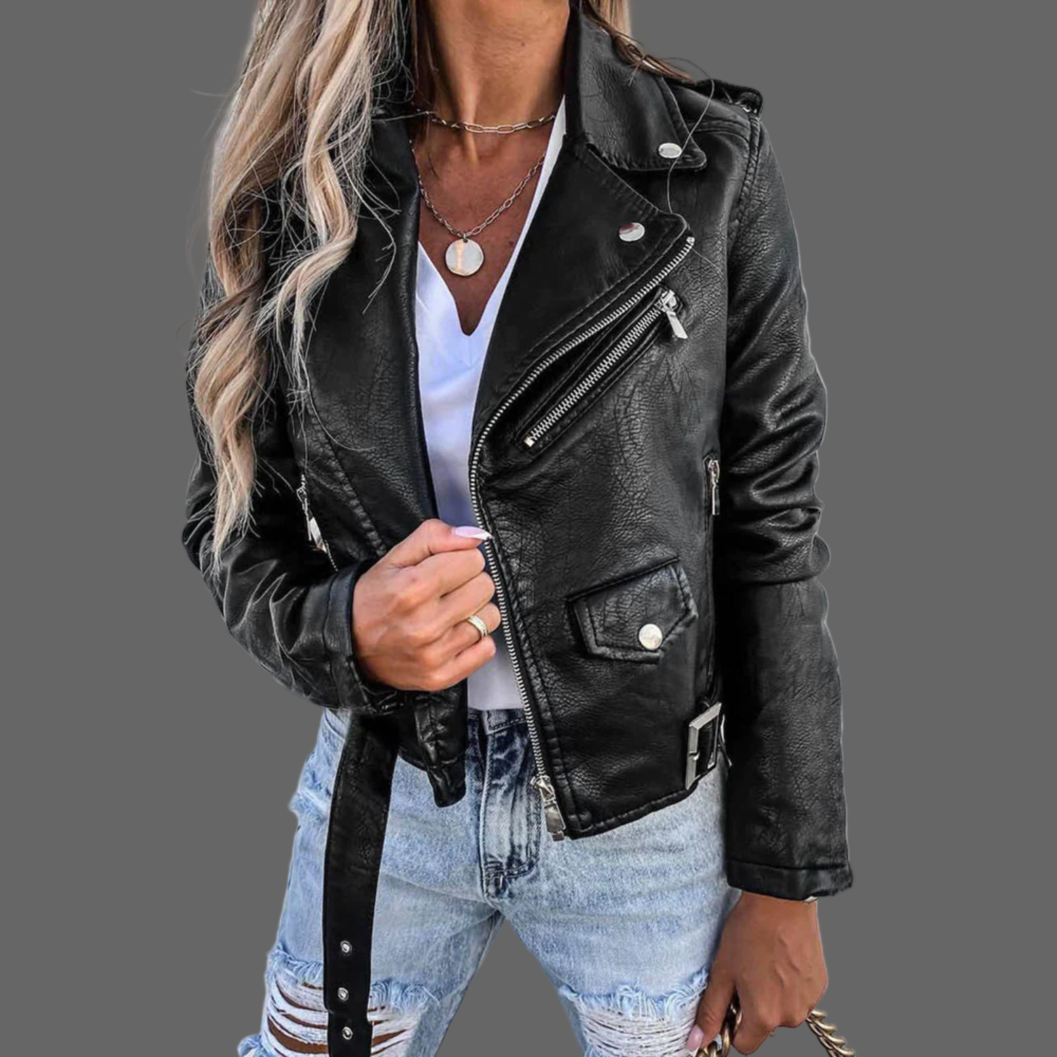 Dames leren jas gemaakt van premium leer, met een stijlvol design inclusief taille accentuerende riem. Verkrijgbaar in trendy rood en zwart, en geschikt voor diverse gelegenheden. Maattabel beschikbaar voor de juiste pasvorm.